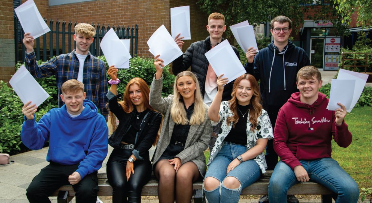 Image showing group of SERC Higher Education students outside holding with their results